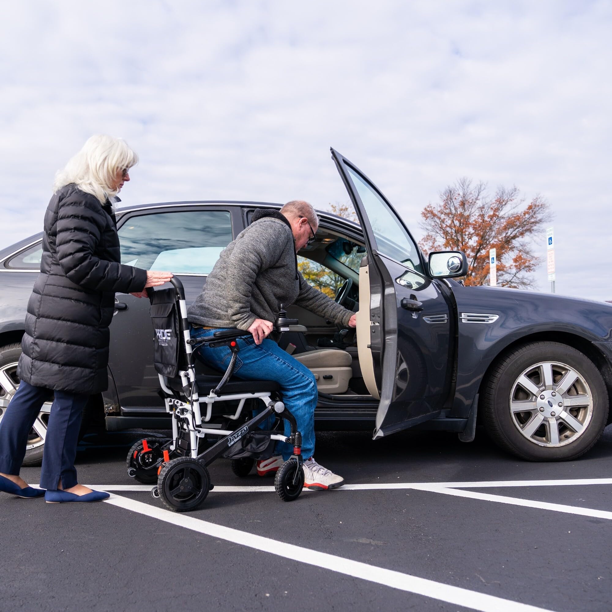 Pride Mobility Jazzy Carbon Power Chair - Electric Wheelchair for Adults, 300 Lbs Weight Capacity, 12 Ah Battery, White, 17"x17" Black Foam Seat